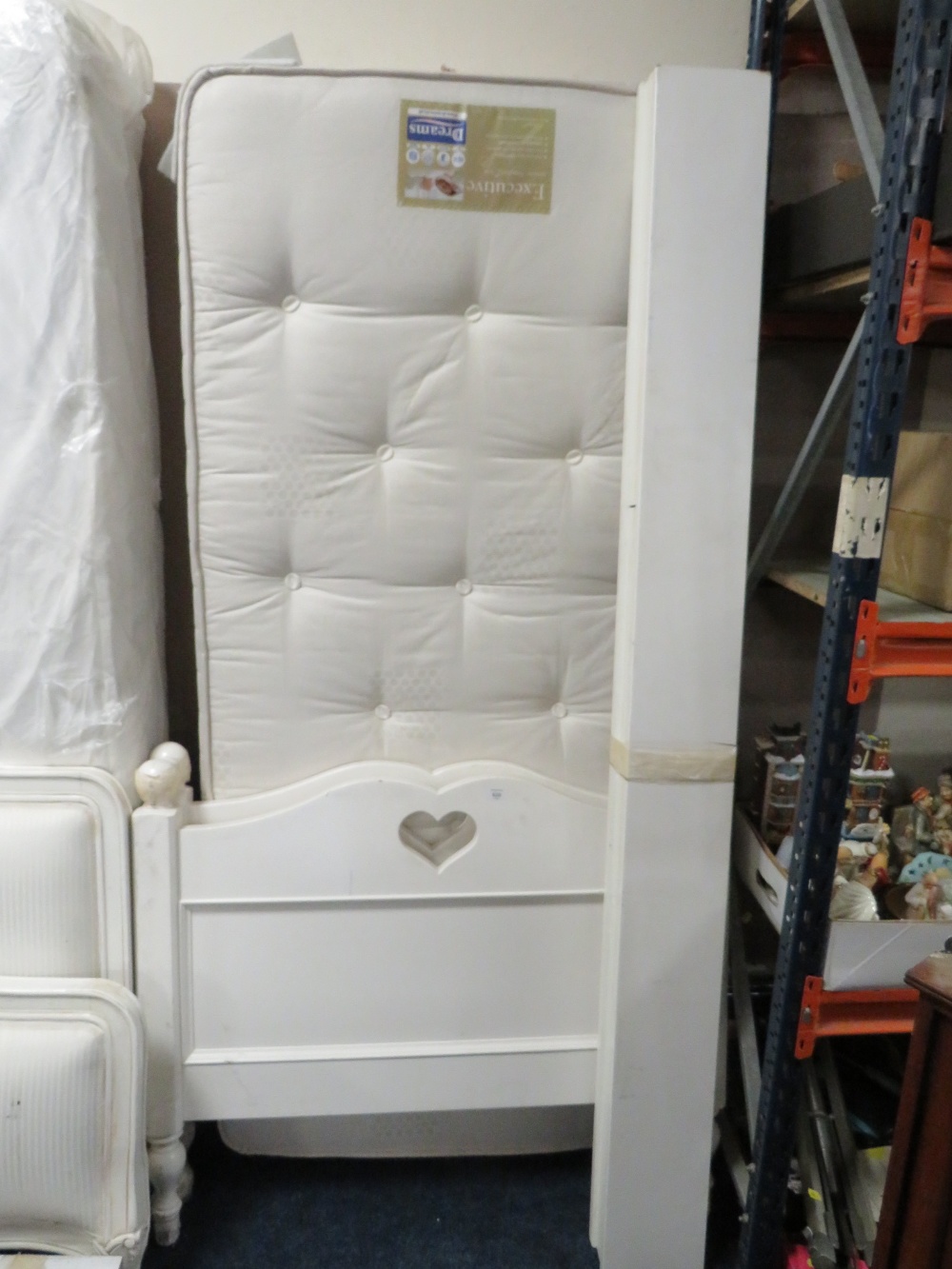 A MODERN SINGLE BED FRAME AND MATTRESS