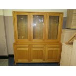 AN M & S SONOMA COLLECTION LIGHT OAK WALL UNIT, GLAZED 3 DOOR UNIT ABOVE A COMBINATION OF DRAWERS