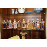A COLLECTION OF TEN EUROPEAN RUSTIC DOLL MODELS