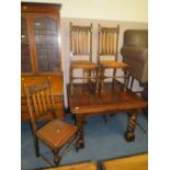 A 1930'S STYLE OAK BARLEYTWIST DRAWLEAF TABLE, WITH FOUR CARVED BARLEYTWIST DINING CHAIRS