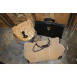 A MODERN WICKER PICNIC HAMPER SET TOGETHER WITH A LEATHER TYPE CARRY BAG & ANOTHER