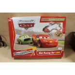 A MICRO SCALEXTRIC WORLD OF CARS SLOT RACING SET