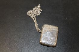 AN ANTIQUE HALLMARKED SILVER VESTA CASE ON SILVER CHAIN