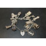 A VINTAGE SILVER CHARM BRACELET WITH LARGE CHARMS