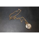 A VICTORIAN DOUBLE SIDED LOCKET MARKED 9CT ON ROLLED GOLD CHAIN