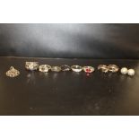 A BAG OF SILVER DRESS RINGS, EARRINGS ETC