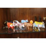 A COLLECTION OF NINE UNUSUAL MODERN COW PARADE FIGURES TO INCLUDE BEEFEATER CHEEZY ETC