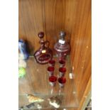 A COLLECTION OF RED GLASSWARE TO INCLUDE AN ETCHED GLASS WHISKY JUG