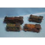 THREE 'O' GAUGE CLOCKWORK TANK UNITS together with an 'O' gauge clockwork locomotive 4-4-0