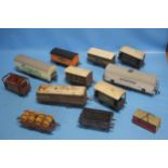 TWELVE CARRIAGES AND ROLLING STOCK, to include tin plate and plastic examples