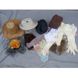 A COLLECTION OF VINTAGE ACCESSORIES, to include a small selection of gloves and hats, a fur bonnet