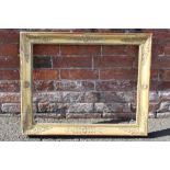 A 19TH CENTURY DECORATIVE GOLD FRAME, frame W 7 cm, rebate 65 x 50 cm