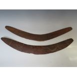 TWO OCEANIC AUSTRALIAN ABORIGINAL EARLY 20TH CENTURY HUNTING BOOMERANGS, with carved designs,