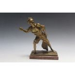 A CAST METAL FIGURE OF A MAN THROWING A STONE, on marble base, H 19.5 cm