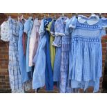 A COLLECTION OF VINTAGE CHILDRENS DRESSES, varying fabrics, patterns and sizes, together with a