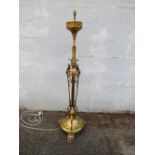 AN EARLY 20TH CENTURY BRASS ART NOUVEAU LAMP STANDARD, with stylised floral detail, raised on a
