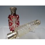 A RUBY AND CLEAR FLASH CUT SCENT BOTTLE, flask shaped body with decorative white metal hinged lid, H