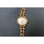 A HALLMARKED 9 CARAT GOLD 21 JEWEL ANTI MAGNETIC ACCURIST WRIST WATCH, approx weight 10.5g, Dia 1.