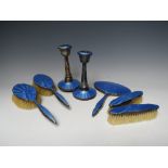 A HALLMARKED SILVER GUILLOCHE ENAMEL DRESSING TABLE SET, comprising a hand mirror, two hand brushes,
