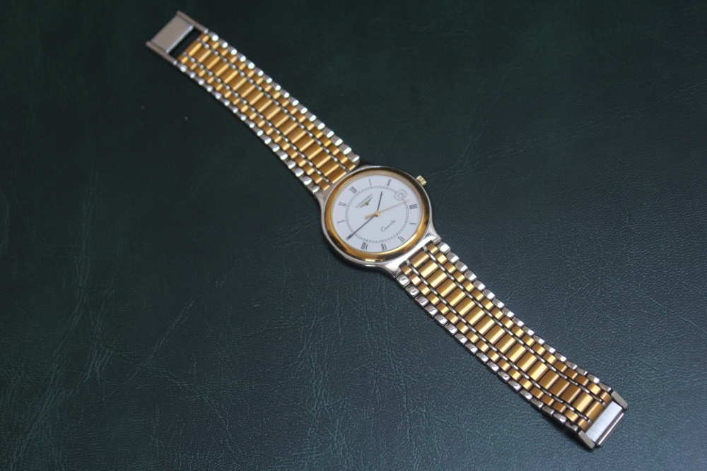 LONGINES - A BICOLOUR DATE WRIST WATCH, with box, papers, guarantee etc, Dia 3.5 cmCondition