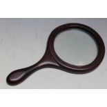 AN ANTIQUE MAHOGANY MOUNTED MAGNIFYING GLASS, L 21 cm