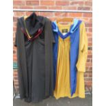 A SELECTION OF ACADEMIC ROBES / CAPS ETC., to include an Ede and Ravenscroft coloured robe with