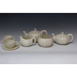 A BELLEEK EIGHT PIECE TEA SERVICE, comprising large and small teapot, cream jug and sugar bowl and