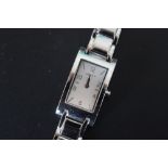 A LADIES RECTANGULAR DKNY STAINLESS STEEL WRISTWATCH, W 2 cm