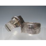 A HALLMARKED SILVER HINGED BANGLE WITH ENGRAVED DESIGN - CHESTER 1958, together with a hallmarked