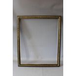A LATE 19TH / EARLY 20TH CENTURY EBONISED FRAME, with decorative gold strip to the centre, frame W 4