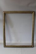 A LATE 19TH / EARLY 20TH CENTURY EBONISED FRAME, with decorative gold strip to the centre, frame W 4