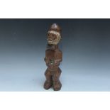 A CARVED TRIBAL FIGURE, H 30 cm