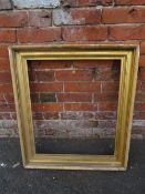 AN EARLY 19TH CENTURY GILTWOOD RECTANGULAR PICTURE FRAME, rebate 63 x 54 cm