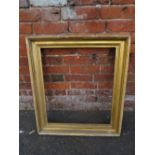 AN EARLY 19TH CENTURY GILTWOOD RECTANGULAR PICTURE FRAME, rebate 63 x 54 cm