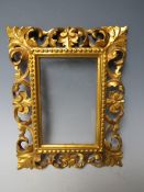 A 19TH CENTURY GOLD CARVED WOODEN FLORENTINE FRAME, frame W 4.5 cm, rebate 15 x 10 cm