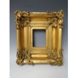 AN 18TH CENTURY SMALL GOLD SWEPT FRAME, frame W 9 cm, rebate 15.5 x 12.5 cm