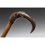 A NOVELTY WALKING CANE WITH ART NOUVEAU STYLE BONE HANDLE, embellish with metal inlay, L 92 cm