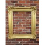 A 19TH CENTURY RECTANGULAR GILT WOOD FRAME, with carved foliate detail to the corners, rebate 74 x