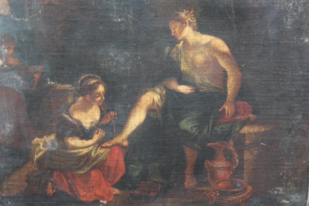 ITALIAN SCHOOL (17TH CENTURY). A lady tending to a gentleman's foot, oil on canvas, unframed, 48.5 x