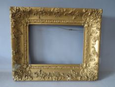 A 19TH CENTURY DECORATIVE GOLD FRAME A/F, frame W 8 cm, rebate 26 x 35 cm