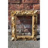 A 19TH CENTURY CARVED WOODEN GOLD FRAME, frame W 8 cm, rebate 33 x 26 cm