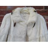 A VINTAGE ERMINE FUR CAPE, with attached tails to the collar, fully lined