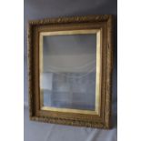 A LATE 19TH / EARLY 20TH CENTURY GOLD FRAME, with acorn and oak leaf design to outer edge and gold