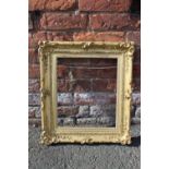 A 19TH CENTURY GOLD SWEPT FRAME WITH GOLD SLIP, frame W 5.5 cm, slip rebate 36 x 31 cm, frame rebate