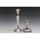 TWO HALLMARKED SILVER CANDLESTICKS CONSISTING OF A SQUAT EXAMPLE BY HARRISON BROTHERS AND HOWSON -