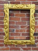 AN EARLY 19TH CENTURY RECTANGULAR GILT WOOD FRAME, in the Florentine style, pierced detail to the