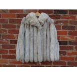 A VINTAGE LEATHER AND SILVER / FAWN TIPPED FOX FUR JACKET, fully lined, two pockets, Condition