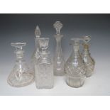 A COLLECTION OF SIX ASSORTED ANTIQUE AND VINTAGE GLASS DECANTERS