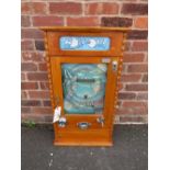A MODERN ALLWIN HOLE IN ONE SEVEN CUP PENNY ARCADE MACHINE MADE BY NOSTALGIC MACHINES, the tall