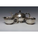 A HALLMARKED SILVER ARTS AND CRAFTS THREE PIECE HAMMERED FINISH TEA SET BY FREDERICK NEWLAND SMITH -